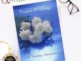 Anniversary Wishes Card with Name This Beautiful Image Shows White Flowers On A Blue Lighted